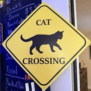 Source Unknown Black Cat Crossing Sign
